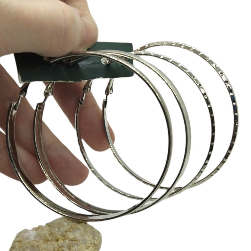 Two pairs of silver hoops‎ so 1990s